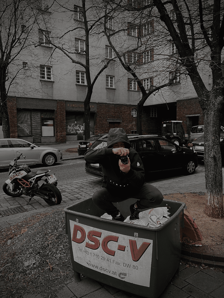 Picture of Erik Weidenauer sitting in trash